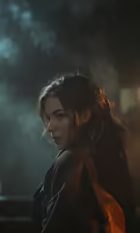 a woman with long hair in the dark