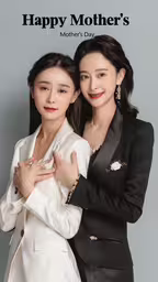 the mother and daughter of two girls are hugging each other,two asian women who are posing for the camera