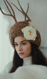 a beautiful young woman with a antlers headband