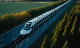 a commuter train is driving down the tracks
