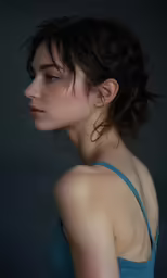 a close up of a young woman wearing a strapless dress