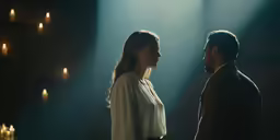 a man and woman standing next to each other