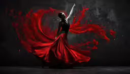 woman in dress with red flowing hair on dark background