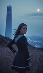 the woman is posing in front of a tall building