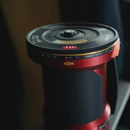 a camera lens that is on a desk