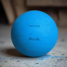a round blue object on a white table