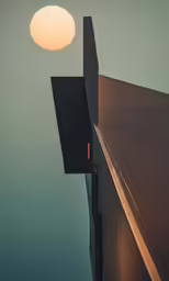 a building has a shadow coming from it against the sky