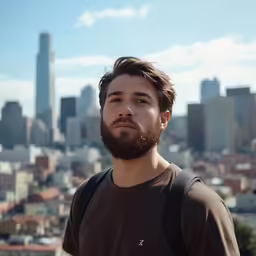 a man with a beard is staring into the distance