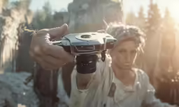 a person holding up a camera with both hands