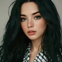 a woman with a plaid shirt and green hair