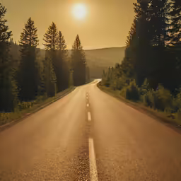 long road with three lane that goes to the sun
