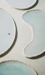 different patterns and shapes of white and blue clay