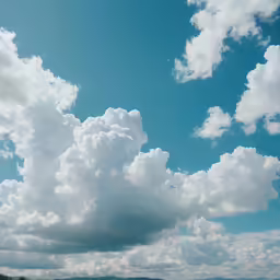 some people are walking on a road with clouds and a green field