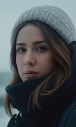an image of a woman with blue eyes looking off into the distance
