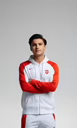 a man standing in front of a white and red outfit