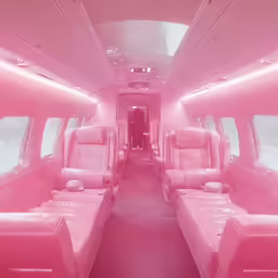 an inside shot of the back of a pink limousine