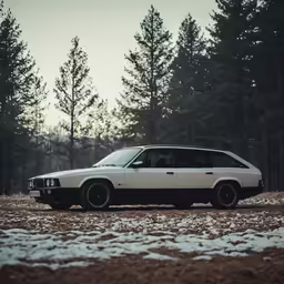 an old station wagon parked on snow covered ground