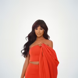 an image of a woman with long hair wearing an orange outfit