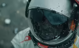 person wearing motorcycle helmet and goggles looking at something