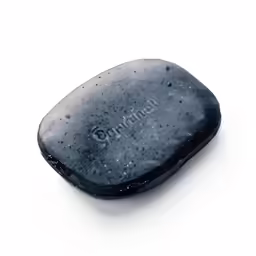 a hair brush in the shape of a square black soap
