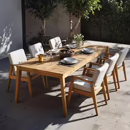 the dining table is set up with eight white chairs