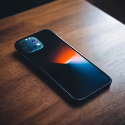 an iphone with its camera up to the camera