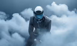 a man sitting on top of some clouds wearing a blue mask
