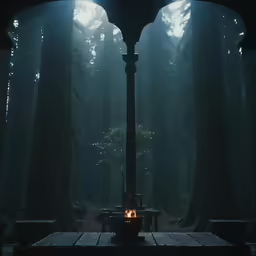 a wooden bench with a lantern lit at the end