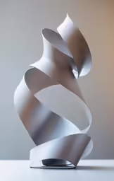 an unusual metal sculpture is shown on the table