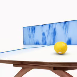 a yellow ball is on top of a table