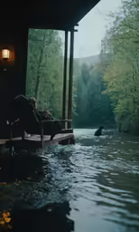 a chair sitting in the water under a wooden roof