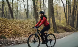 there is a woman that is riding her bicycle