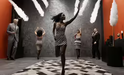 a model in a striped dress walks down the runway