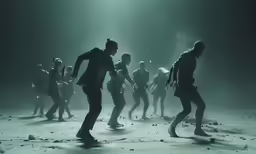 a group of people dancing in the middle of a desert