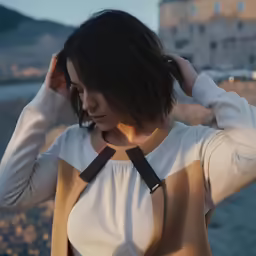 a young woman is standing on the beach with her head on his hands