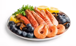 lobsters, shrimp, oranges, lemons and blueberries on a white plate