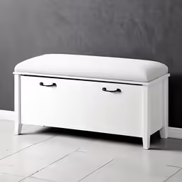 a white bench with storage drawers on top of it