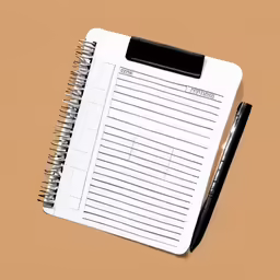 a pen on top of a notebook with a list in the pages
