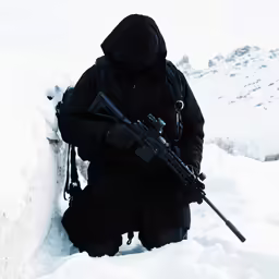 a person with a gun in the snow
