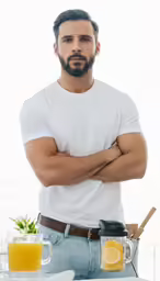 a man with a beard is holding his arms crossed
