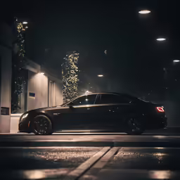 the black sports car is parked on the street