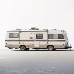 an rv is parked on the street in the winter