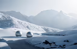 snow covered ground with white balls near the edge of a mountain
