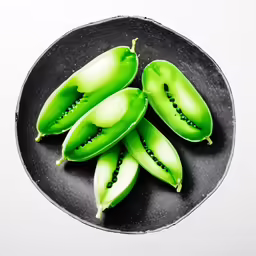 some peas are cut in half on a plate