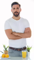 a man with a beard, in a white shirt is standing near oranges and cups