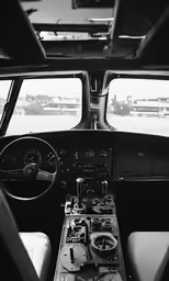 the controls in a small aircraft with many dashboards
