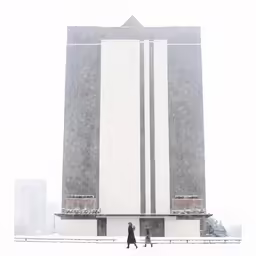 two people walking in the snow by a big tall building