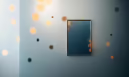 a square mirror on the wall with dots in the reflection