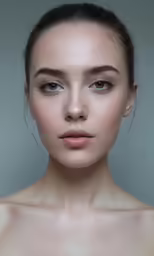 the young woman is posing in front of the camera
