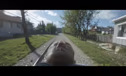 the person is watching the street from a car